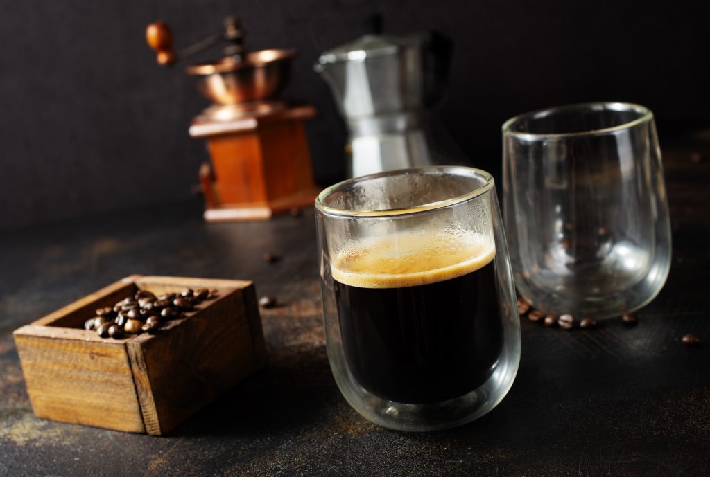 An espresso shot and cold brew beside a blended frappe.
